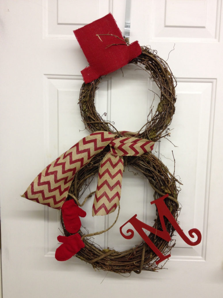 Two simple grapevine wreath could become a stylish snowman welcoming your guests.