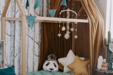 a beautiful forest-inspired kids’ room with an unique bed is lively yet not too bright, with a perfect balance