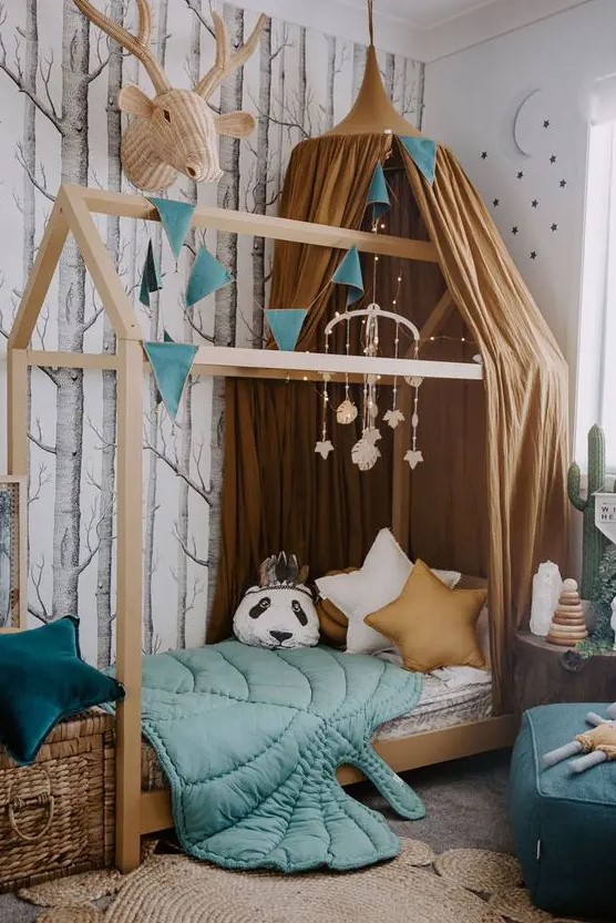 A beautiful forest inspired kids' room with an unique bed is lively yet not too bright, with a perfect balance