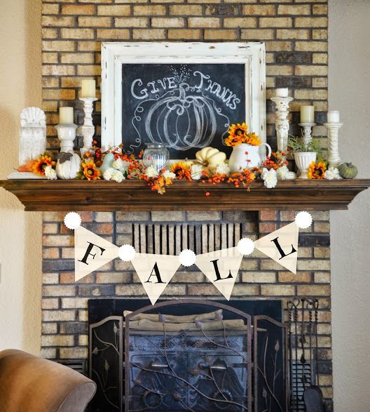 A bold vintage Thanksgiving mantel with berries, pumpkins and blooms   all faux ones, candles and a chalkboard sign