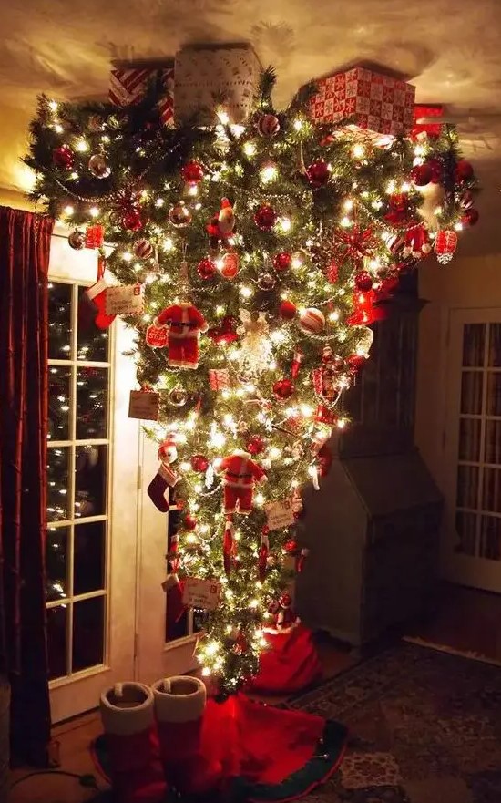 A jaw dropping upside down Christmas tree with silver and red ornaments, letters, beaded garlands and little Santa Claus figurines