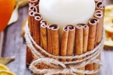 a piallar candle wrapped with cinnamon bark and twine is as easy and very cool craft for the fall with a touch of aroma