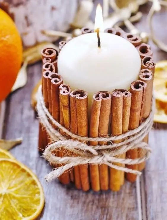 a piallar candle wrapped with cinnamon bark and twine is as easy and very cool craft for the fall with a touch of aroma