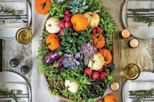 a pretty harvest centerpiece of greenery, succulents and colorful veggies is a gorgeous idea to go for