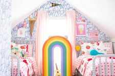 a unique and extra bold attic shared kids’ room with catchy bear wallpaper, beds wiht pink bedding and various pillows, a bold rug