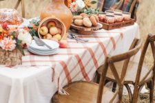 apples in a woven basket, bright blooms, fresh donuts and a bundt cake for a lovely Thanksgiving tablescape