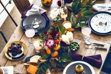 matte black and white plates paired with white and black printed ones and purple napkins for a bright Thanksgiving tablescape