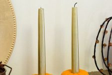 mini faux pumpkins with gold candles are a cool last minute craft that will give a fall feel to the space