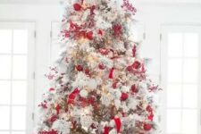 red and white Christmas tree decor is a bold solution and looks bold, contrasting and is always on top as it’s classics