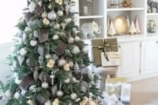 super refined and elegant Christmas tree decor with silver grey ornaments, silver and chocolate brown ribbons plus snowflakes