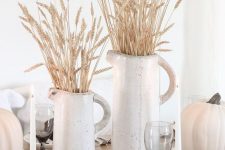 white porcelain jugs with wheat and white pumpkins for a pretty rustic tablescape – a fall or a Thanksgving one