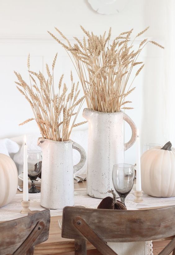 white porcelain jugs with wheat and white pumpkins for a pretty rustic tablescape - a fall or a Thanksgving one