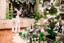 a crazy Christmas tree with buffalo check, green, white, metallic ornaments and ribbons, lights and gift boxes