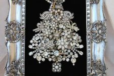 a refined brooch Christmas tree with beads and rhinestones in an embellished silver frame won’t take floor space and will be gorgeous