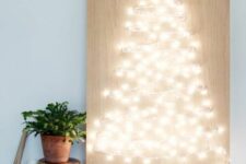 a string light Christmas tree is always a good idea and it’s easy to make yourself, you will need only plywood, lights and nails