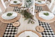 a cozy Christmas table settings with a buffalo check table runner