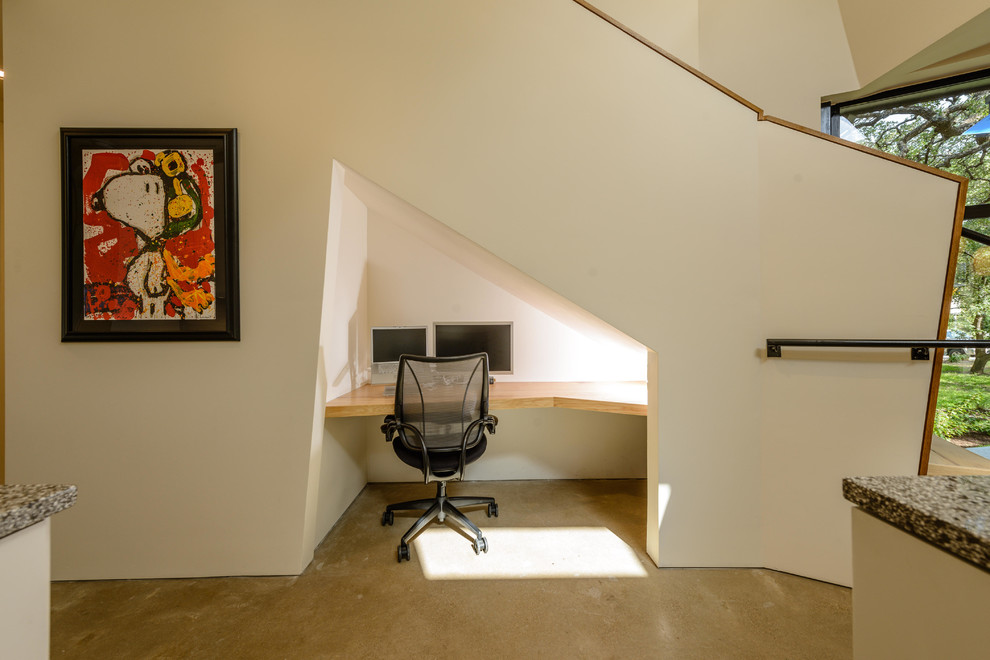 Taking advantage of every bit of space mean you can tuck a small home office under any staircase.