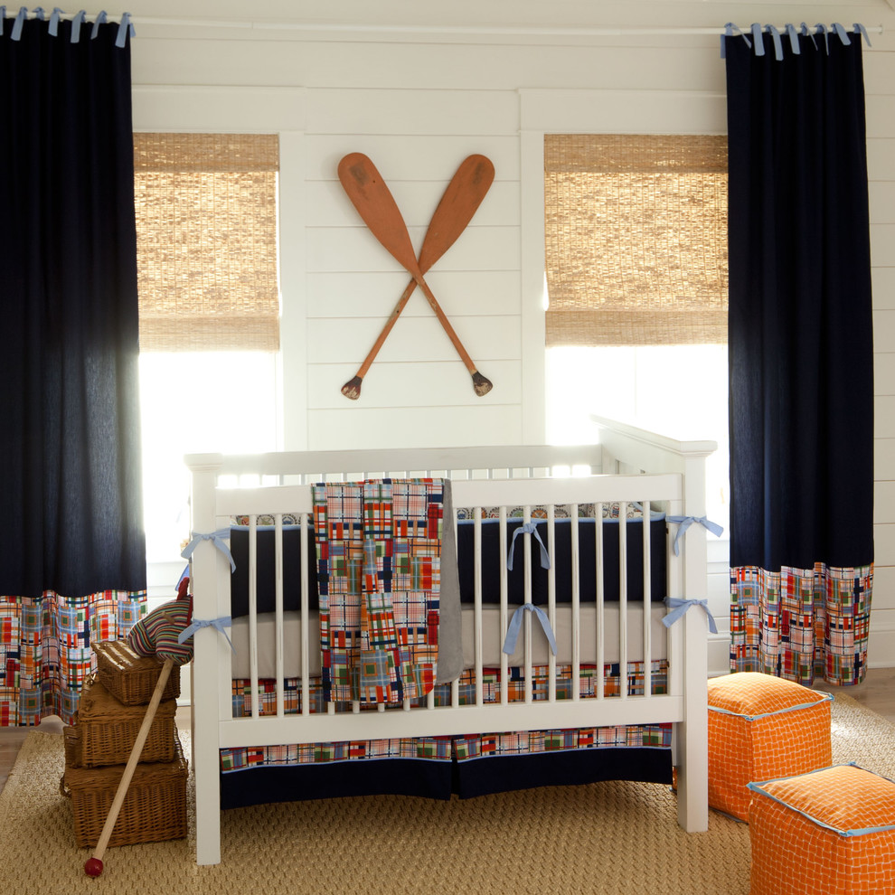 Coastal inspired nursery design where whites and blues are mixed together well.
