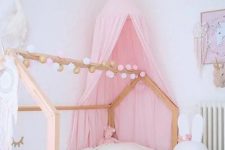 a cute canopy bed works well for a girl’s room