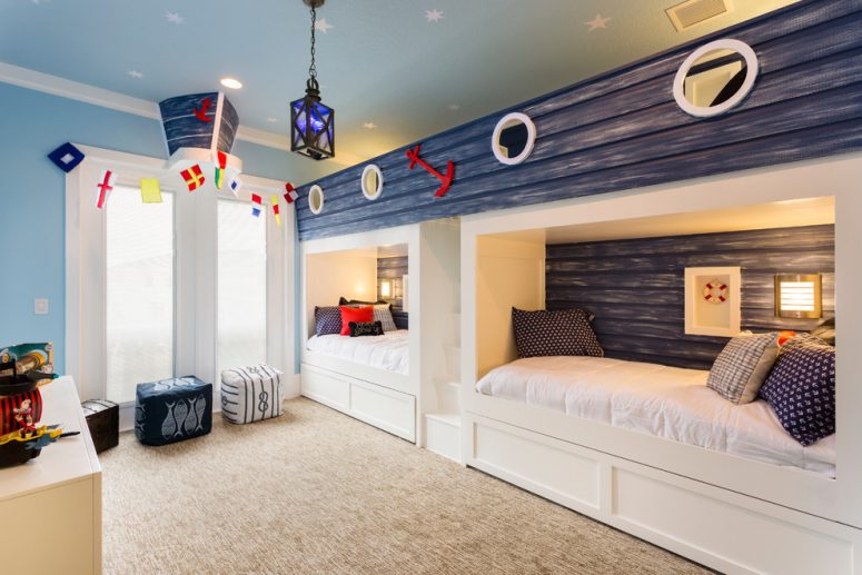 cute beach-inspired shared kids bedroom design with a cozy carpet