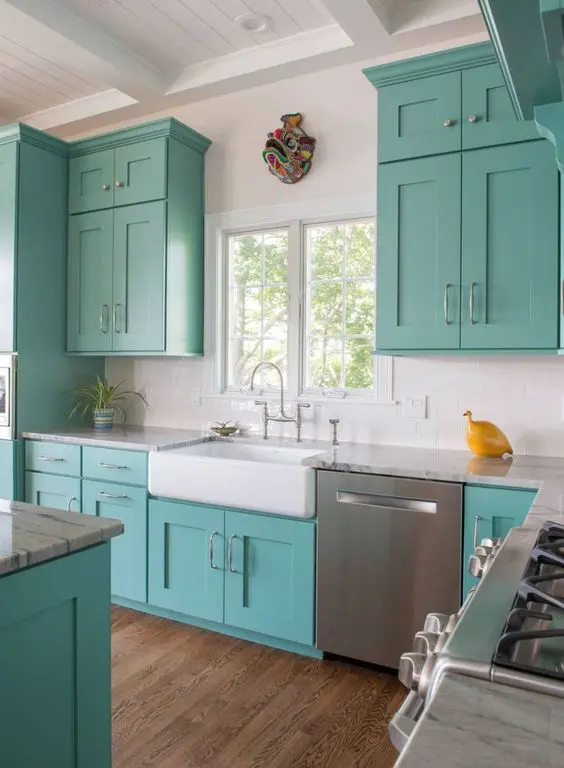 a fun turquoise and white kitchen with a yellow accent is a lovely idea for a beach house or just for a seaside home