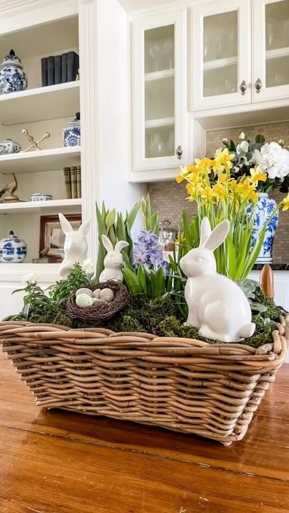 a rustic Easter decoration of a basket with moss, a nest with eggs, some bunnies and colorful spring bulbs is great for spring, too