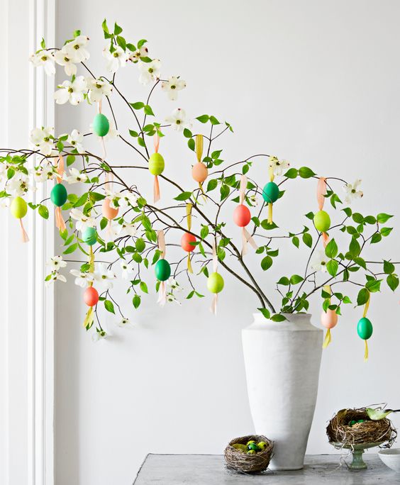 blooming branches with colorful fake eggs are a gorgeous fun Easter tree to rock, you can make it yourself