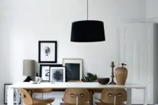 a cute dining space with a gallery wall