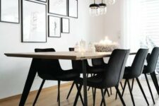 a laconic Scandinavian dining room with a gallery wall, a long table, black chairs, pendant lamps is a lovely space to have meals