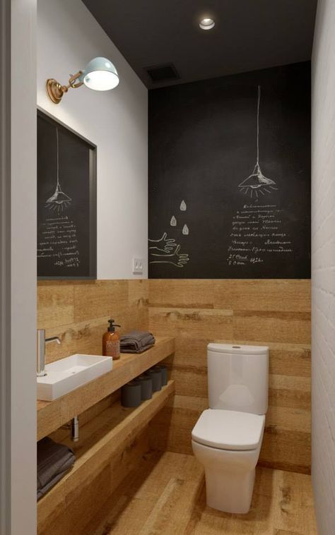A small contemporary guest toilet with wood inspired tiles and chalkboard, a vanity with open shelves and lights
