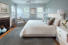 a modern bedroom done in a combo of light blue and grey all over, with some refreshing creamy touches