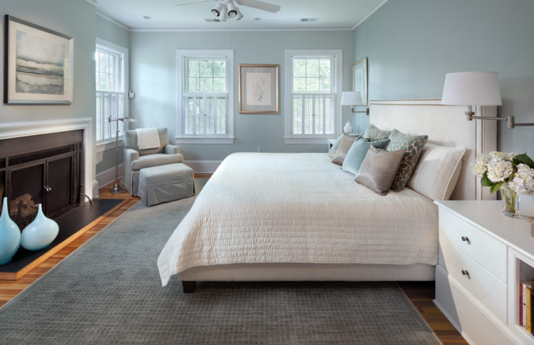 a modern bedroom done in a combo of light blue and grey all over, with some refreshing creamy touches