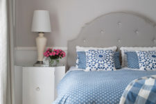stylish modern classics – dove grey walls, curtains, floor and furniture and blue bedding on the bed