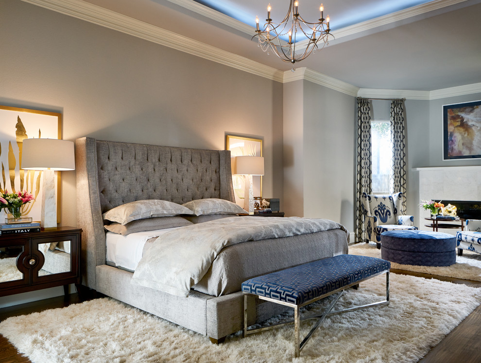 A light grey bedroom with much texture and a single navy accent   an upholstered bench