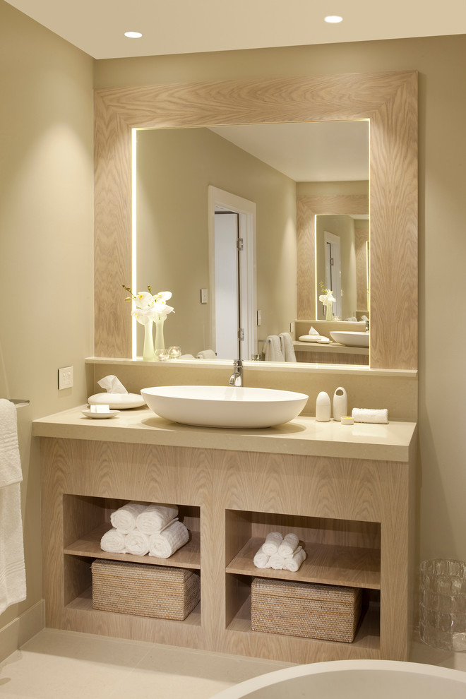 a soft taupe and beige bathroom with a large vanity plus a mirror and inner lights (apaiser)