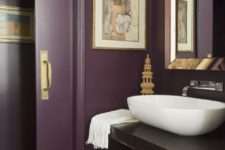 a chic purple bathroom, a floating vanity, metallic touches, a vessel sink and sliding doors