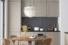 a small grey kitchen with a farmhouse feel, black lamps, a plywood dining set for a laconic and simple look