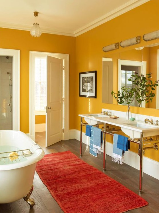 A vintage inspired mustard bathroom with white for a fresh look, vintage appliances and fixtures