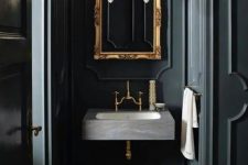 black panels covering the walls create an elegant and chic vintage space, wood clad floors for a refined feel