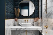 grey marble and teal geometric tles, gold elements and a round mirror for a luxurious and glam bathroom