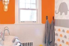 orange, grey and white make up an amazing color scheme for a kids’ bathroom, add a fun print like here and go