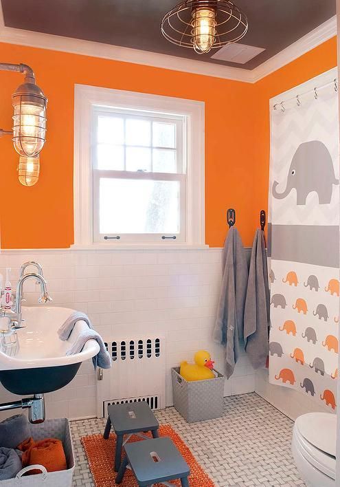orange, grey and white make up an amazing color scheme for a kids' bathroom, add a fun print like here and go