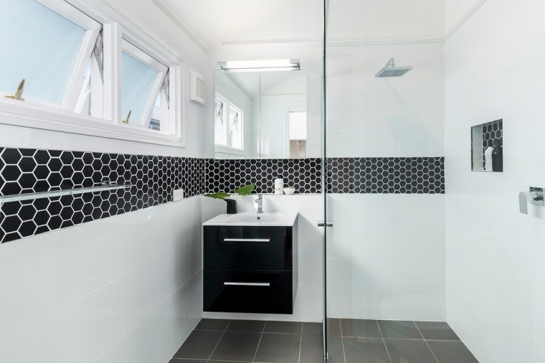 small and trendy bathroom design with cool black hexagonal border tiles