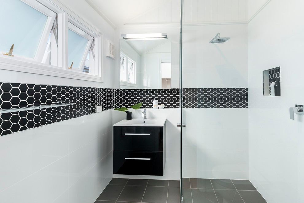 Small and trendy bathroom design with cool black hexagonal border tiles