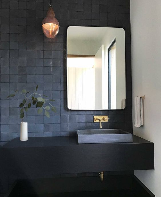 textural matte blue tiles and a black floating vanity for a laconic and very chic bathroom look