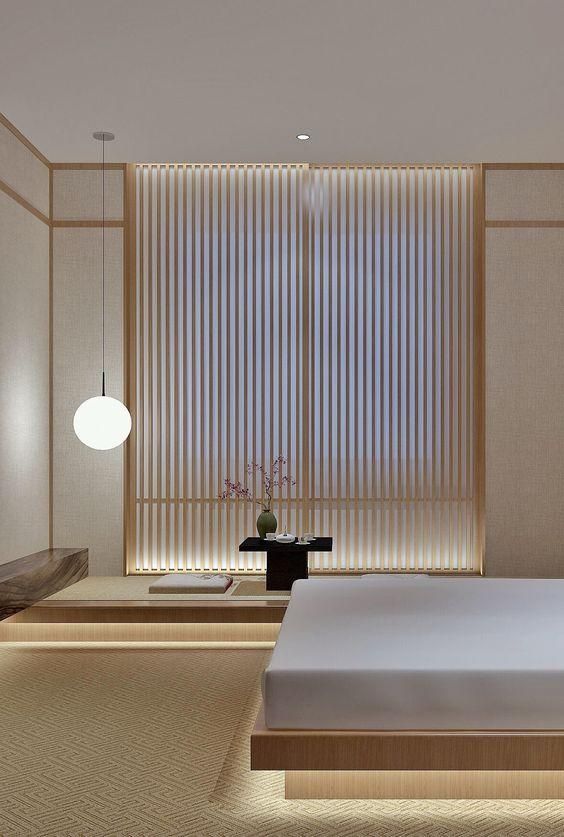 a Japandi bedroom with a wooden screen, low wooden furniture, built-in lights and a tea zone feels very zen-like