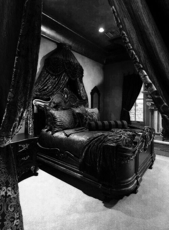 a super dark Gothic bedroom with grey walls and a floor, black furniture with a refined desogn, cnopies and draperies
