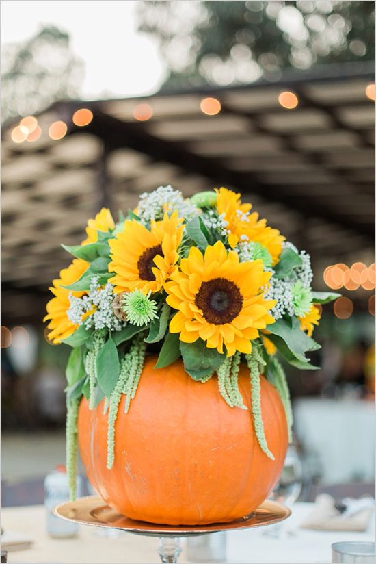 Sunflowers would look gorgeous on any table if you put them in a DIY pumpkin vase.