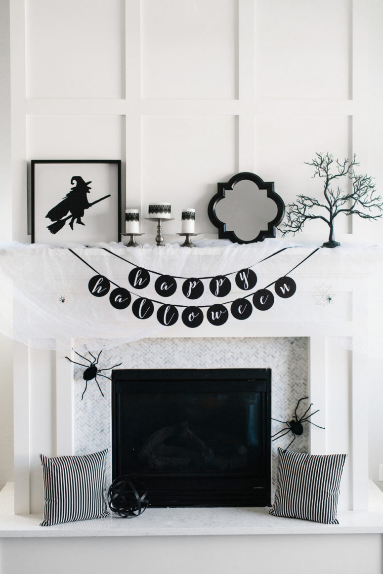 Black and white is a great color theme for a fireplace mantel decor.