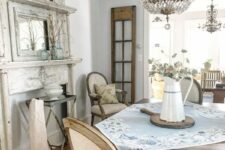 a cute fireplace is a nice addition to a french-style dining room